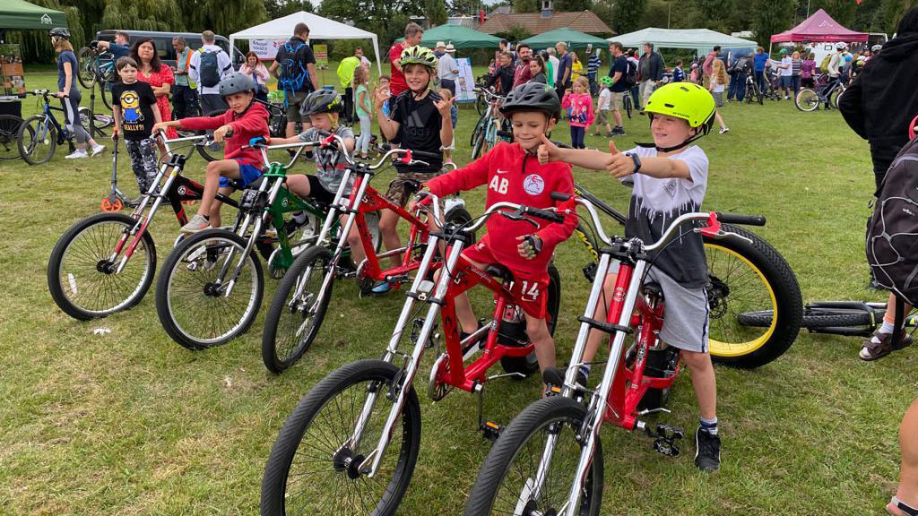 Group of children sitting on low-rider bikes
